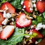 Closeup keto strawberry salad with spinach, basil, pecans and feta