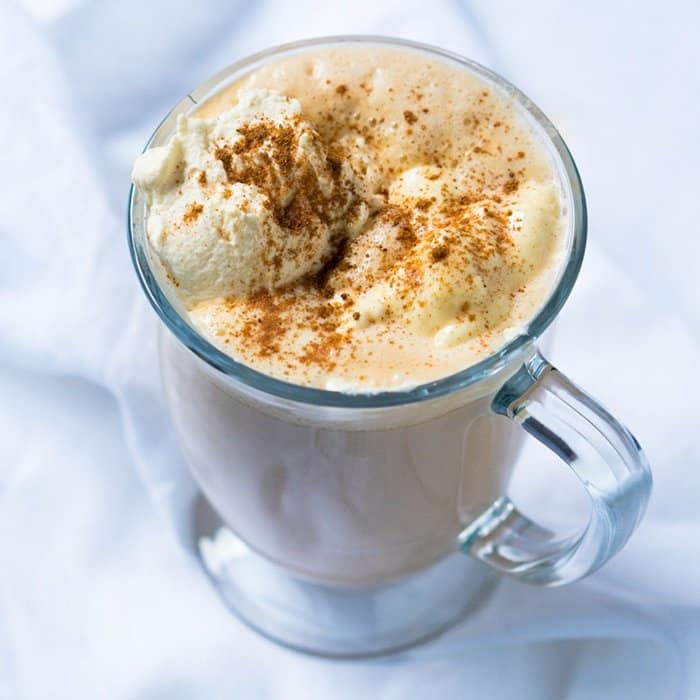 Paleo & keto pumpkin spice latte in a glass mug with whipped cream