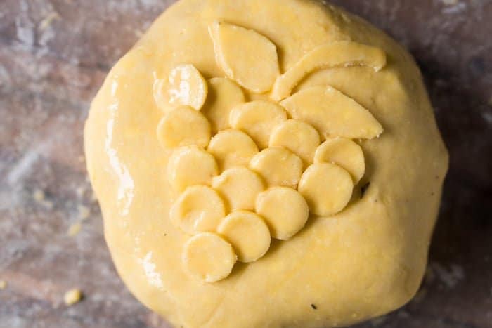 Unbaked keto baked brie with a flakey pie crust