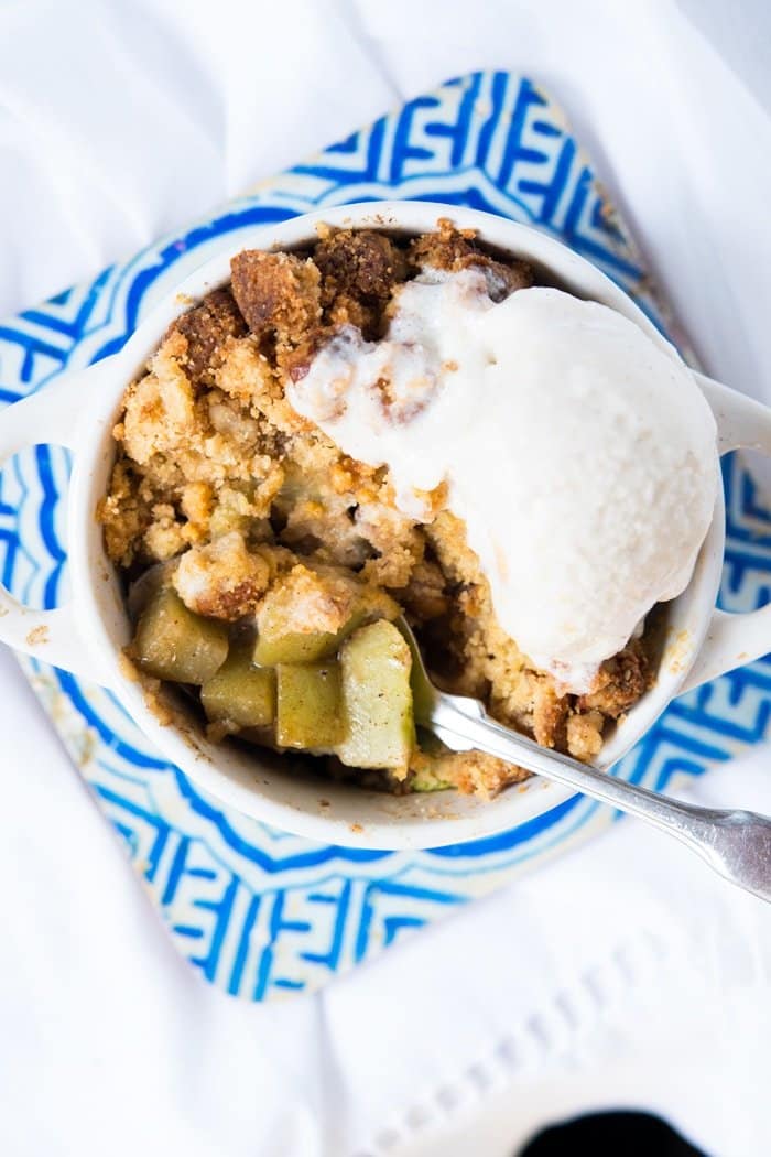 Keto apple crumble with a scoop of vanilla ice cream