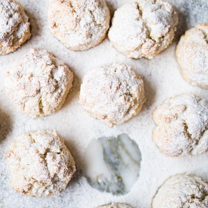 Freshly baked keto amaretti with powdered sugar
