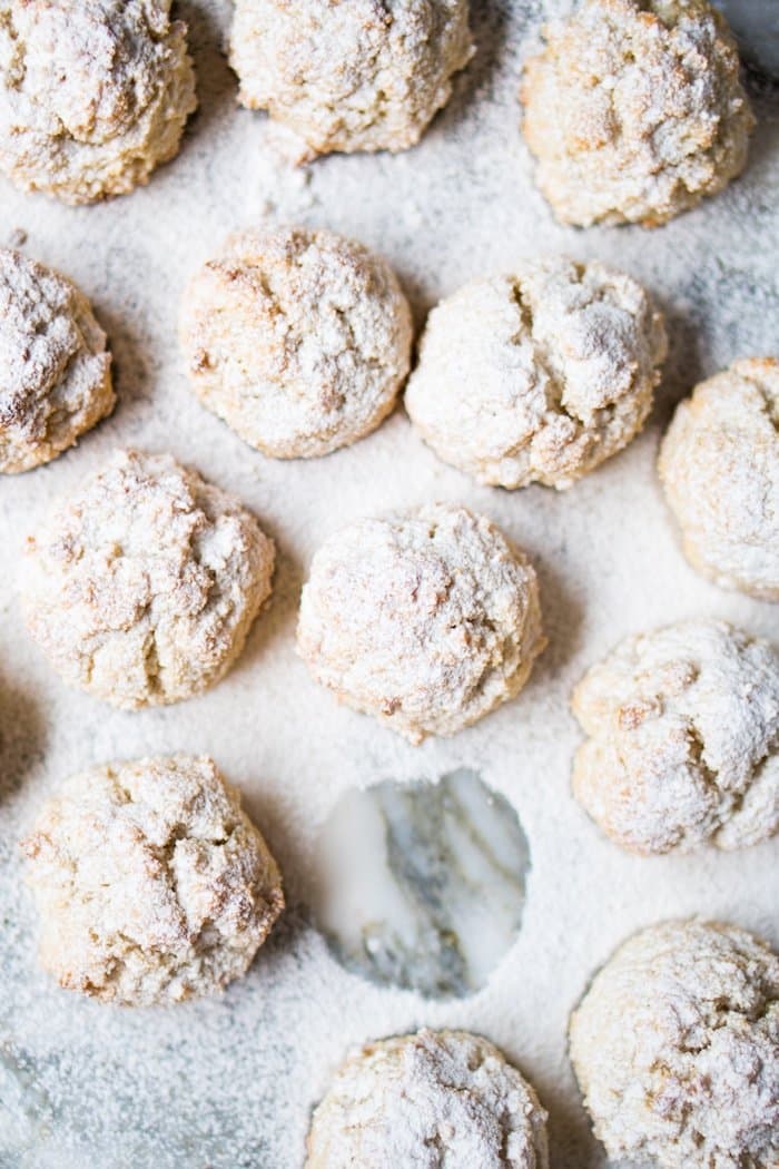 Freshly baked keto amaretti with powdered sugar
