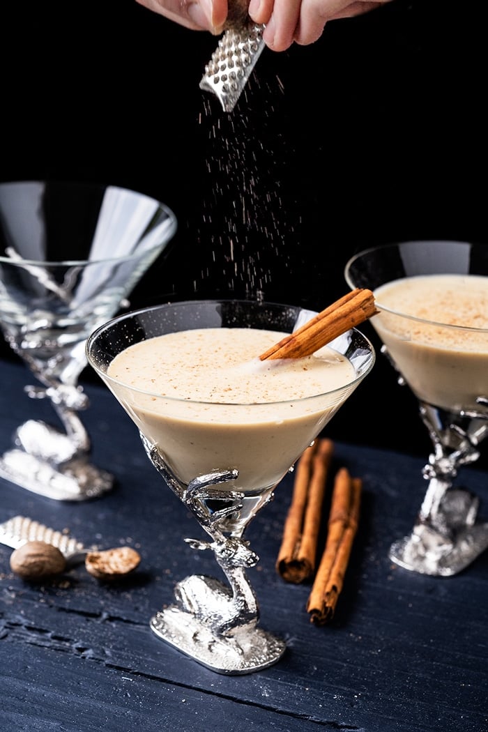 Grating nutmeg onto keto eggnog