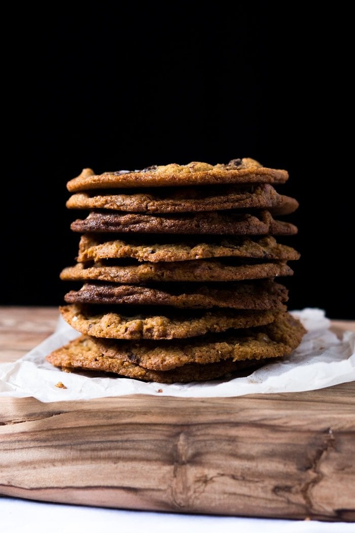A stack of keto chocolate chip cookies with a black background