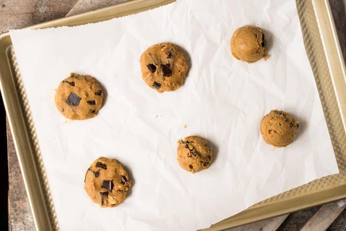 Keto shaped cookie dough on a baking tray with parchment paper