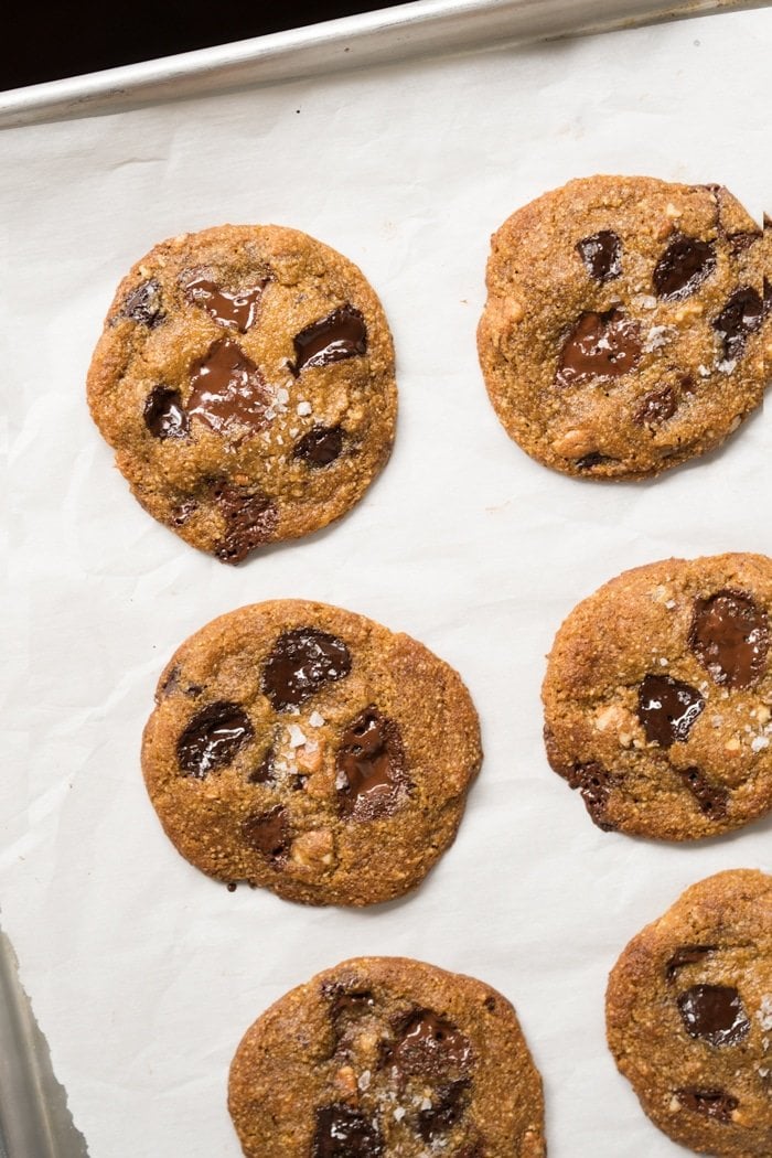 Freshly baked keto chocolate chip cookies on a baking tray
