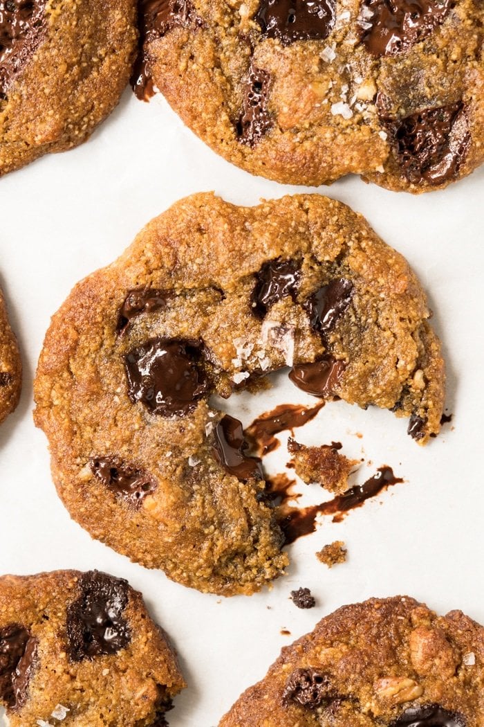 A freshly baked keto chocolate chip cookie with melted chocolate