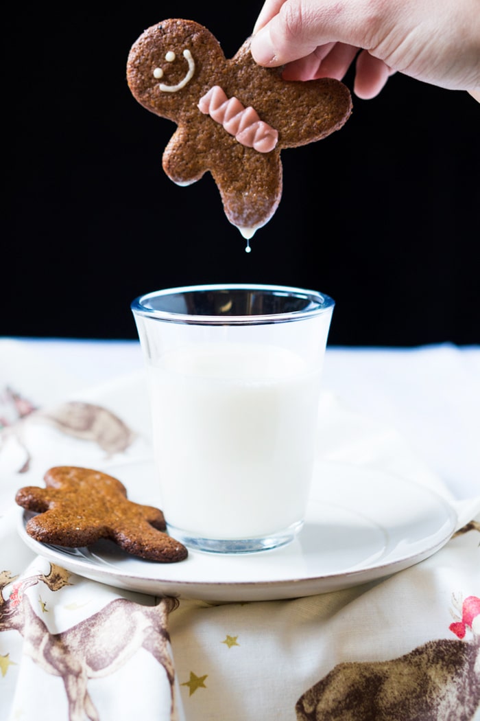 Dunking a keto gingerbread man in milk