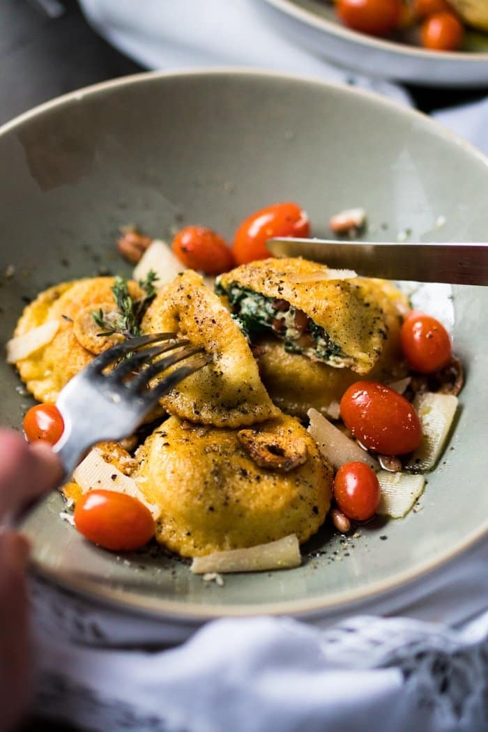 Cutting a keto ravioli with a knife and fork