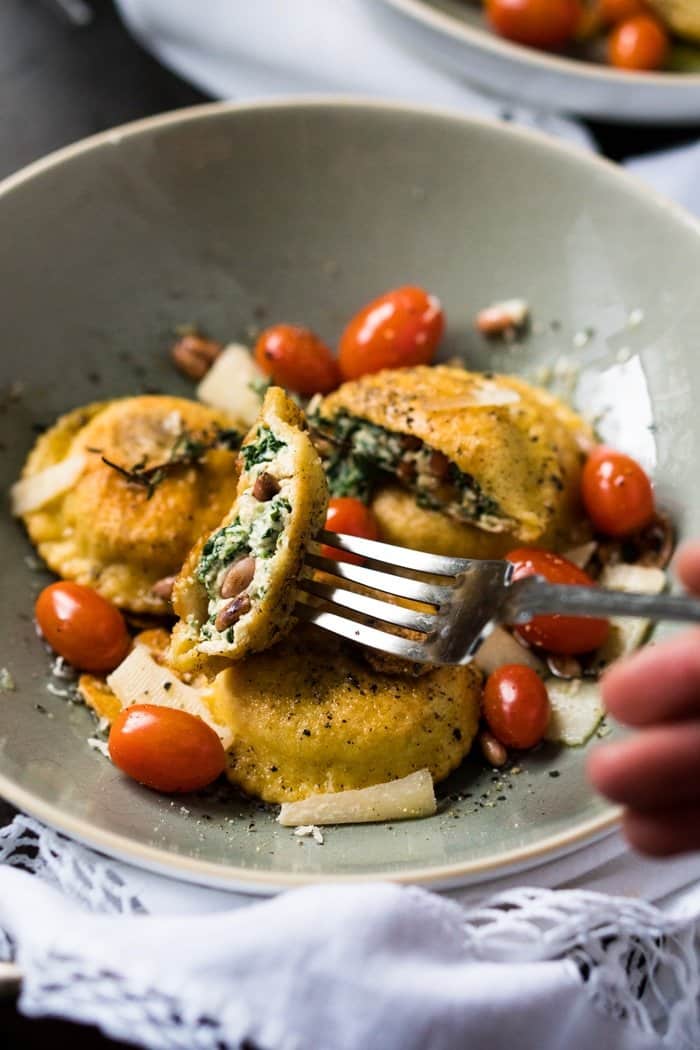 Taking a piece of a keto ravioli with a fork