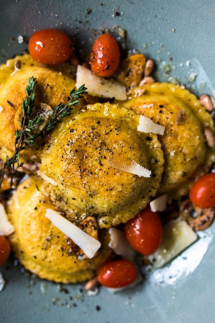 Spinach and ricotta keto ravioli served with cherry tomatoes