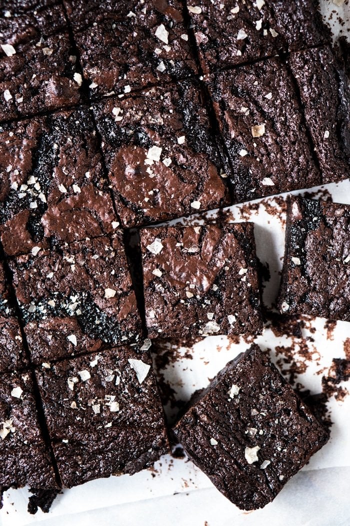 Freshly cut keto brownies with flakey sea salt