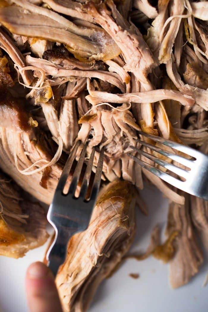 Shredding keto carnitas with two forks