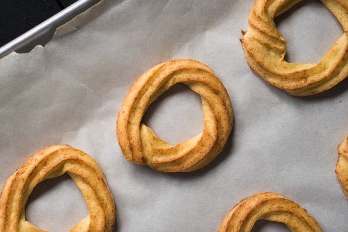 Freshly baked keto churro donuts in a baking tray