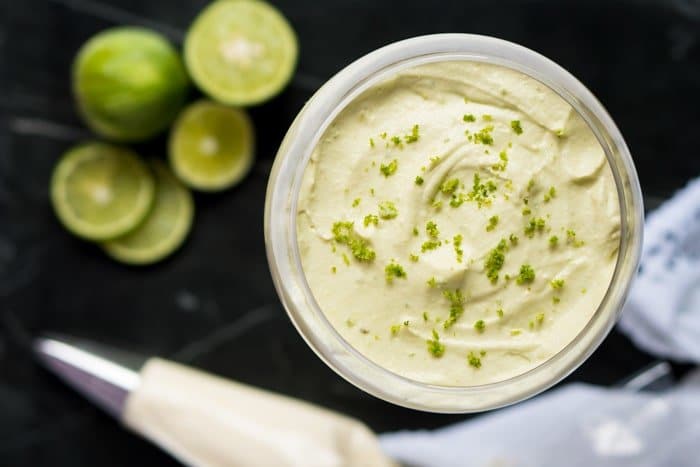 Assembling a no bake keto key lime cheesecake