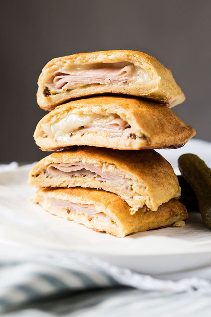 Piled up keto hot pockets with ham and cheese filling