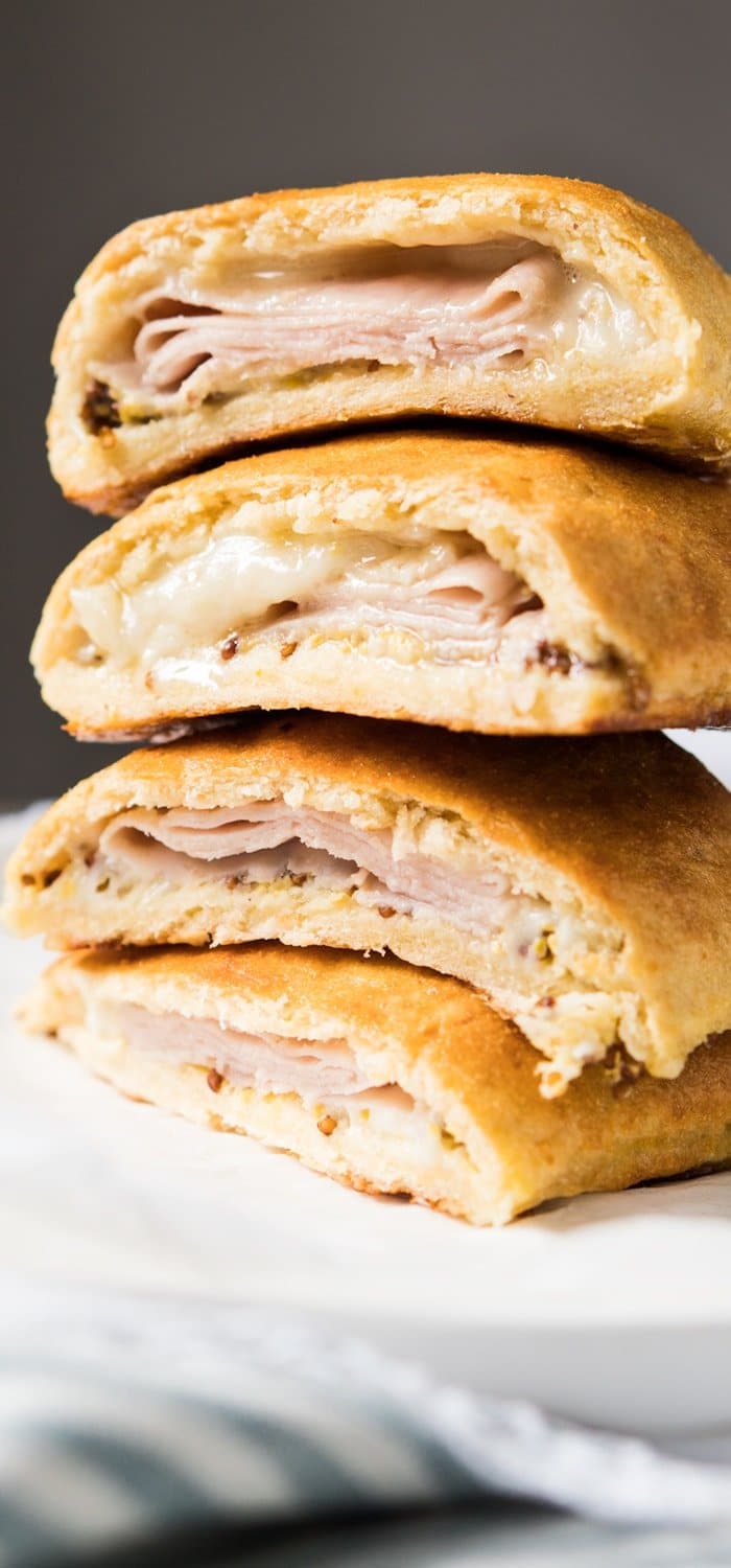 Piled up keto hot pockets with ham and cheese filling