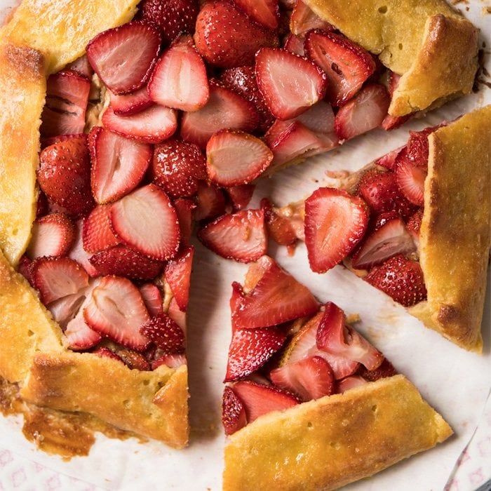 Sliced up keto strawberry galette with pie crust