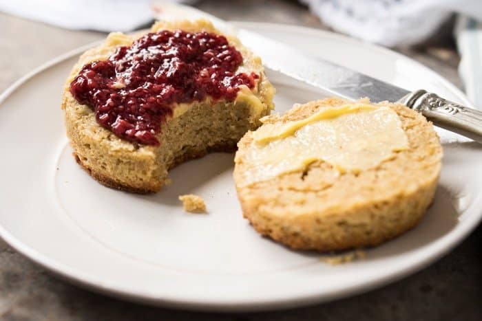 Bitten keto biscuit with butter and raspberry chia jam