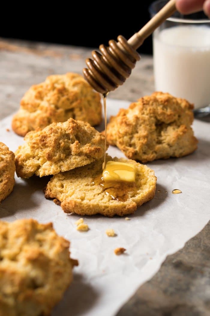 Drizzing sugar free syrup onto keto drop biscuits