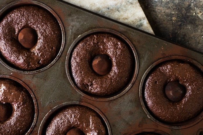 Unbaked keto chocolate donuts in pan