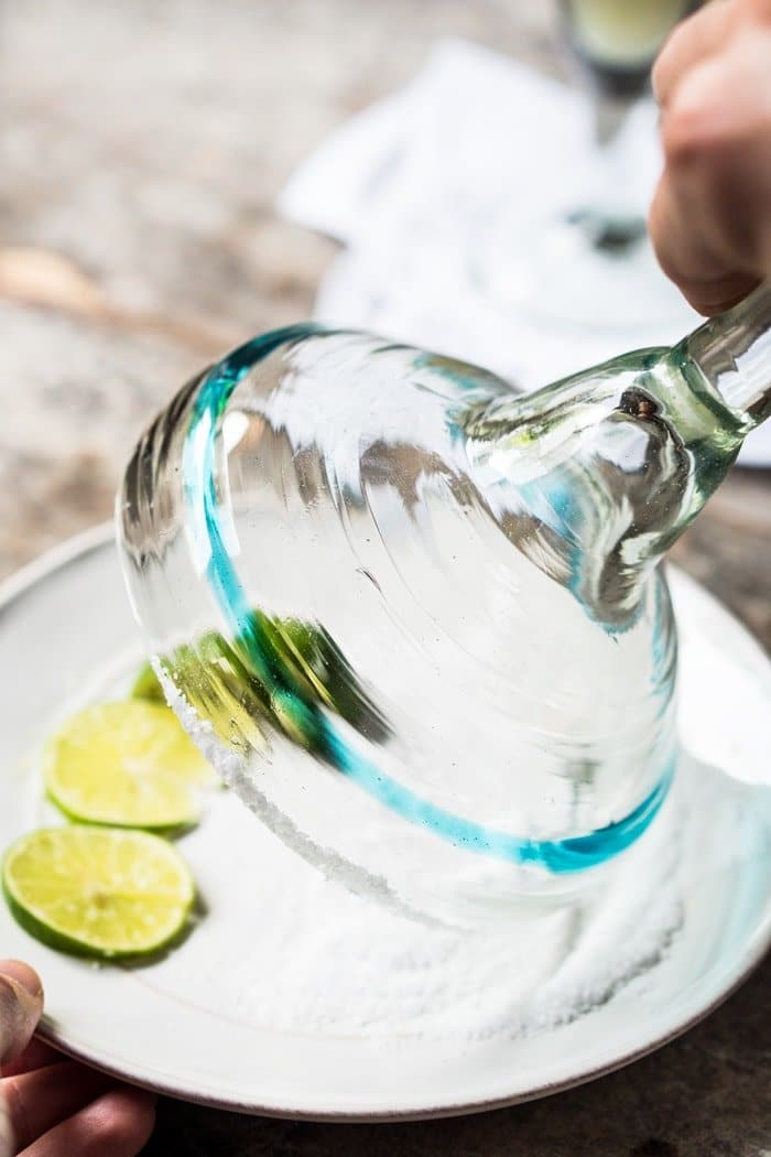 Adding salt to the rim of a margarita glass
