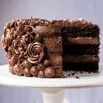 Sliced paleo & keto chocolate cake with cream cheese buttercream frosting