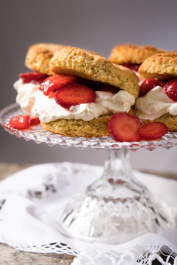 Keto strawberry shortcake with whipped cream on a cake platter