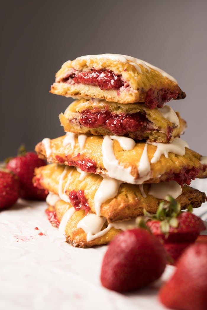 Piled up keto pop tarts with strawberry filling and cheesecake glaze