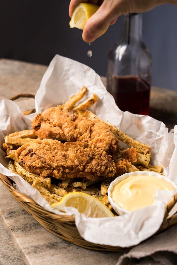 Squeezing lemon onto Keto fish and chips
