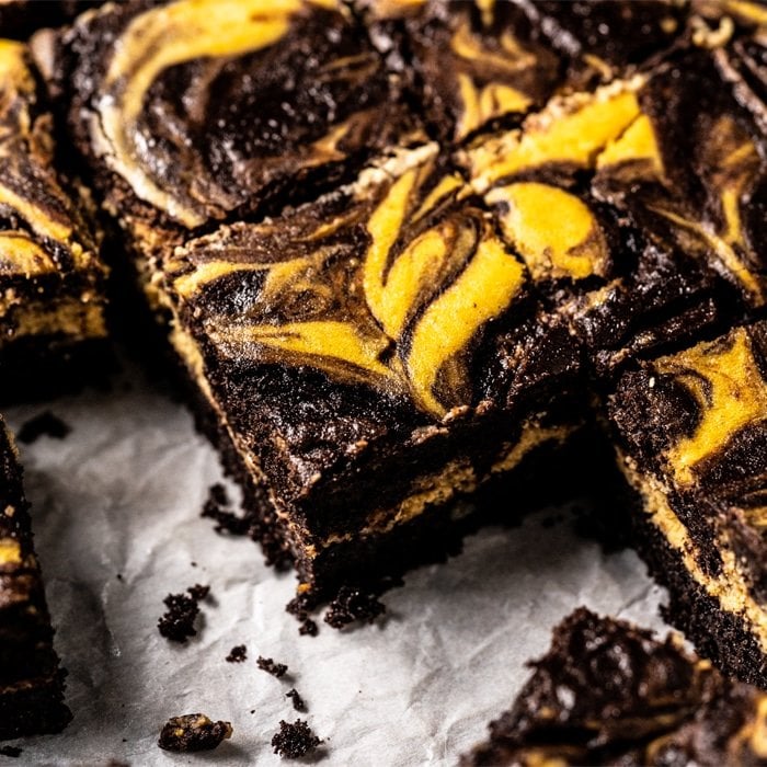 Freshly cut keto pumpkin cheesecake brownies