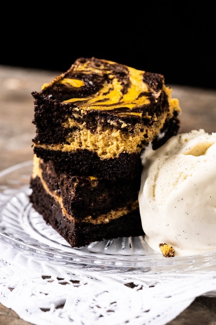 Stacked keto pumpkin cheesecake brownies with vanilla ice cream