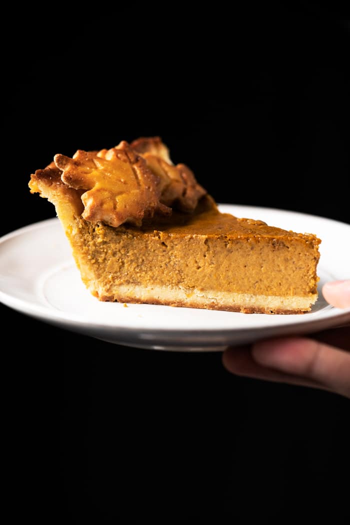 Serving a slice of keto pumpkin pie