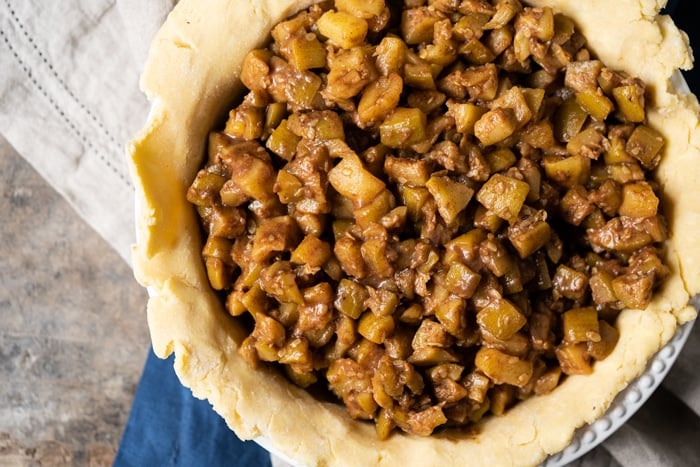 Filling up a keto pie crust with the mock apple filling