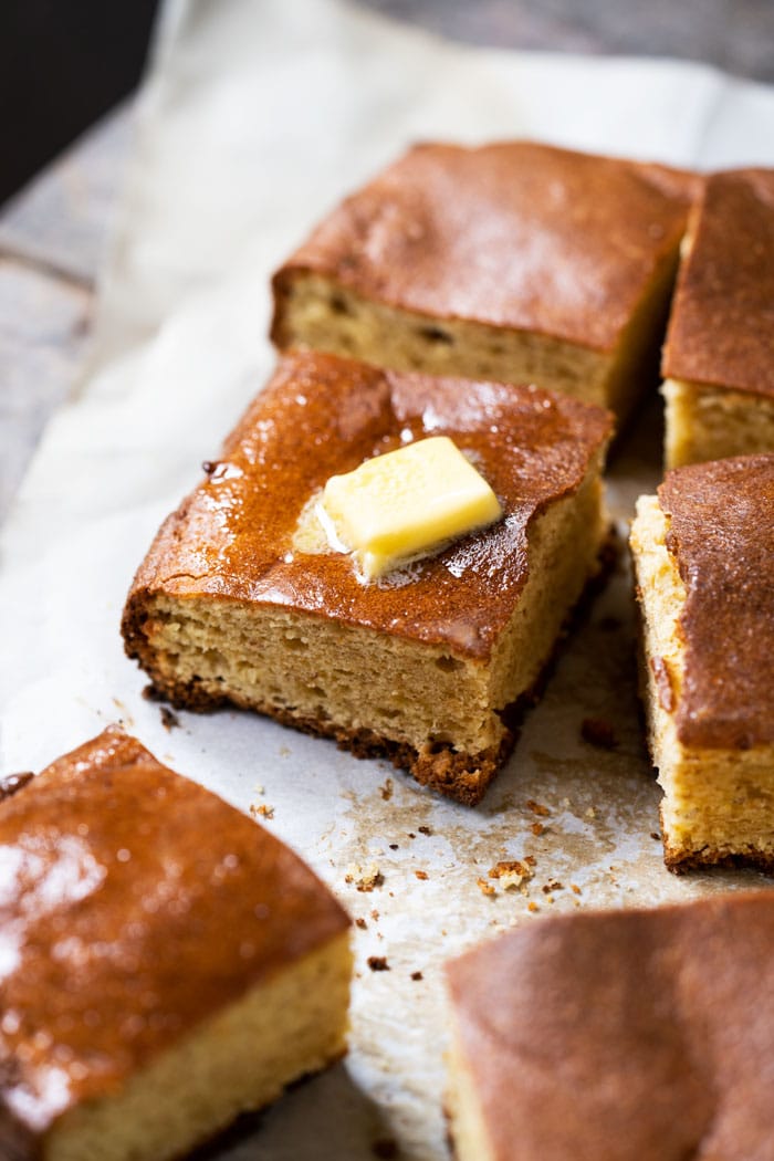 Keto cornbread style quick bread with a pat of butter