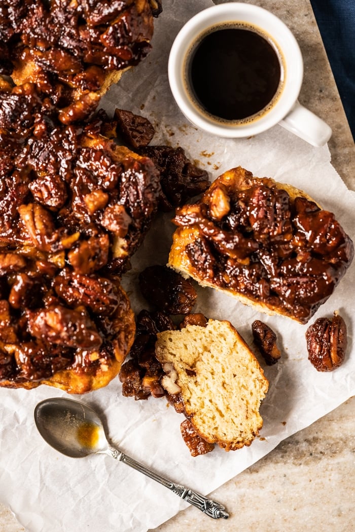 Eating keto pecan sticky buns with a mug of coffee