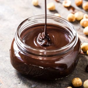 Pouring paleo & keto nutella hazelnut spread