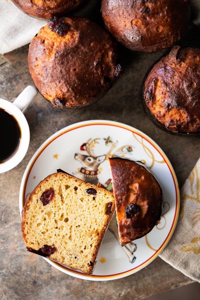 Sliced keto panettone over Christmas plates