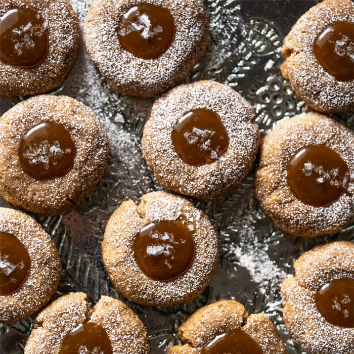 Gluten free & keto salted caramel thumbprint cookies with flakey sea salt