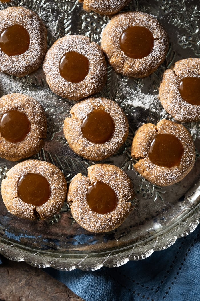 Freshly made keto thumbprint cookies with salted caramel filling