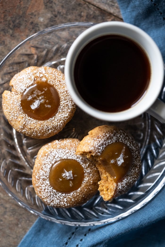 Keto salted caramel thumbprint cookies with a coffee
