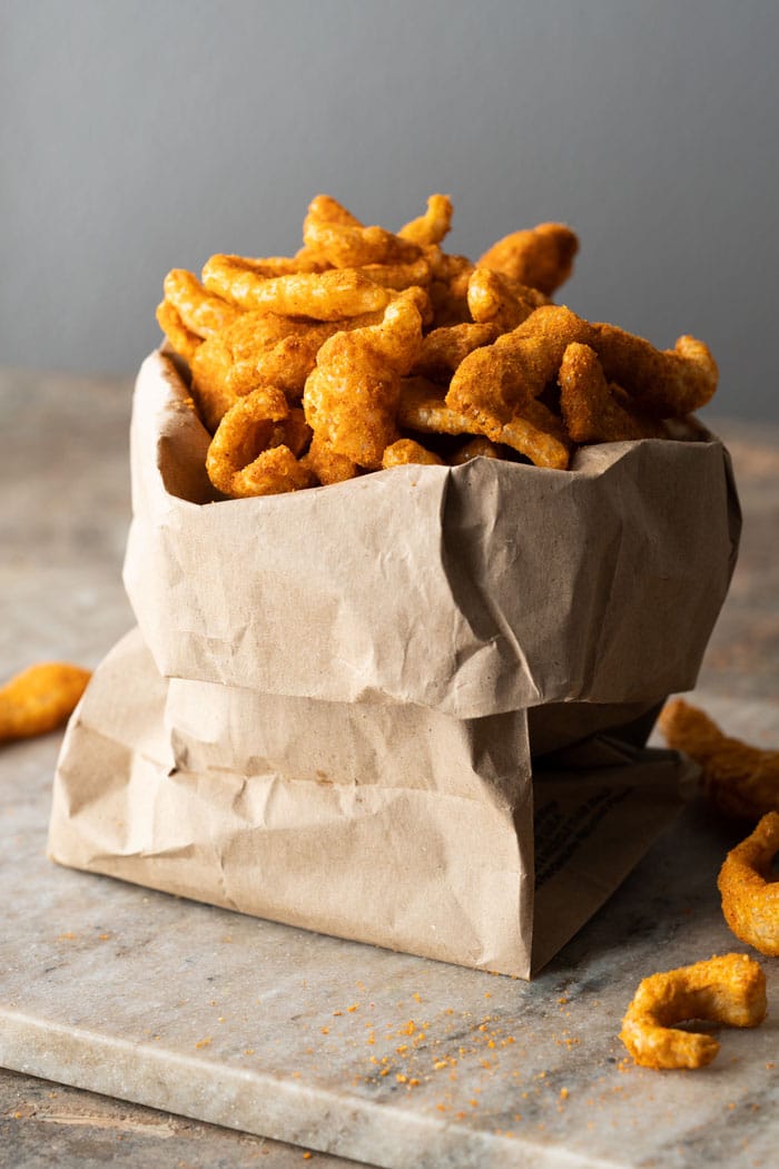 Paleo & keto cheetos in a brown paper bag