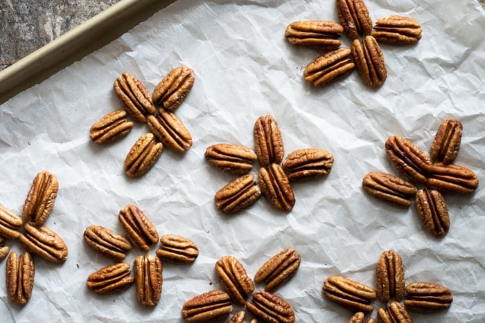 Arranging pecans for keto turtle candy
