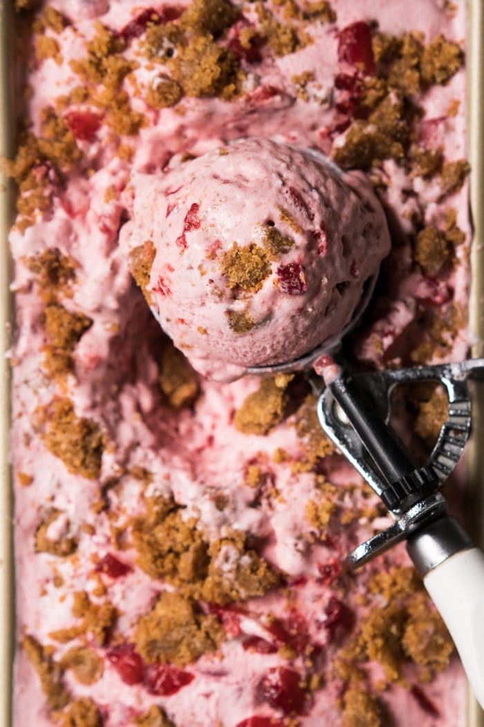 Scooping out gluten free & keto strawberry cheesecake ice cream