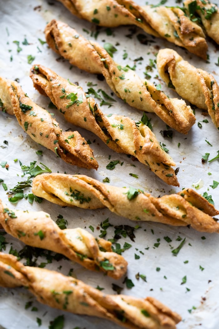 Freshly baked keto garlic bread twists with parsley 