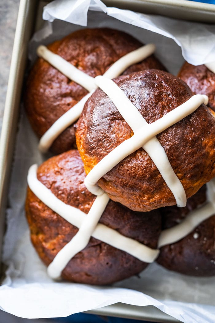Piled up keto hot cross buns with icing