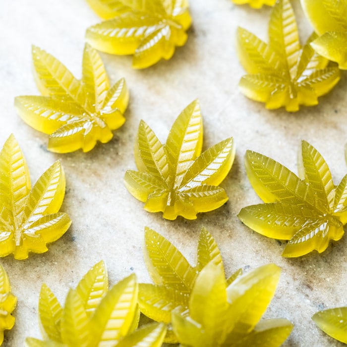 Green keto CBD gummies in cannabis leaf shape