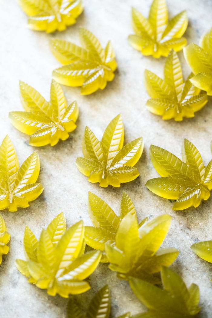 Green keto CBD gummies in cannabis leaf shape