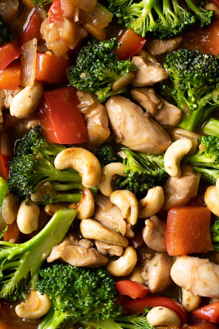Closeup keto cashew chicken with red peppers and broccoli