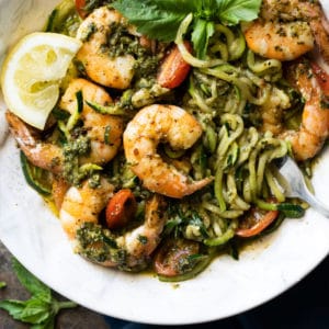 Twirled keto zoodles with pesto, shrimp, lemon & basil